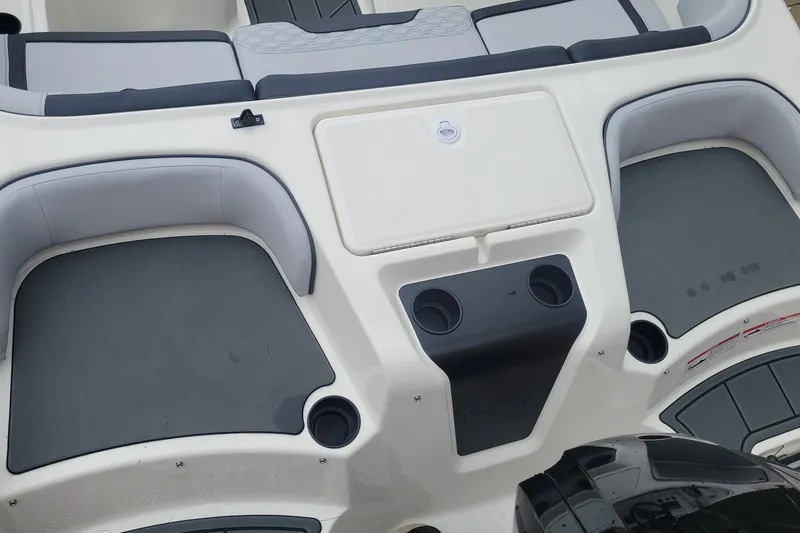 Slide: The Image of 2025 Bayliner Element M17 boat interior with seating and cup holders. - 5