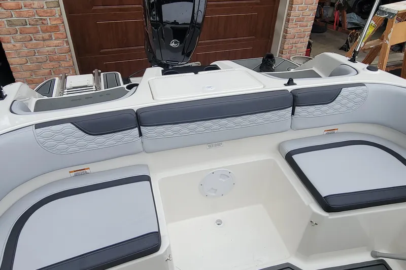 Slide: The Image of 2025 Bayliner Element M17 boat interior with cushioned seating and modern design. - 7