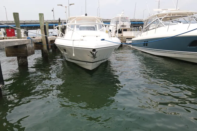 Slide: The Image of 2010 Intrepid 390 Sport Yacht docked at marina, front view. - 18