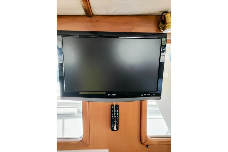 Slide: The Image of Sharp TV mounted on a 1978 Puget 38 Europa Trawler interior. - 26