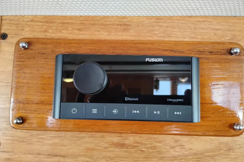 Slide: The Image of Fusion audio system on 1978 Puget 38 Europa Trawler, featuring Bluetooth and SiriusXM capabilities. - 42