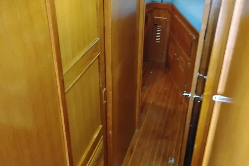 Slide: The Image of Wooden interior hallway of a 1978 Puget 38 Europa Trawler yacht. - 43
