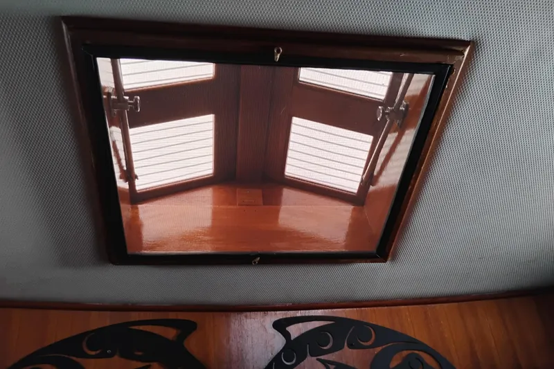 Slide: The Image of Ceiling hatch view inside 1978 Puget 38 Europa Trawler, showcasing wooden interior details. - 50