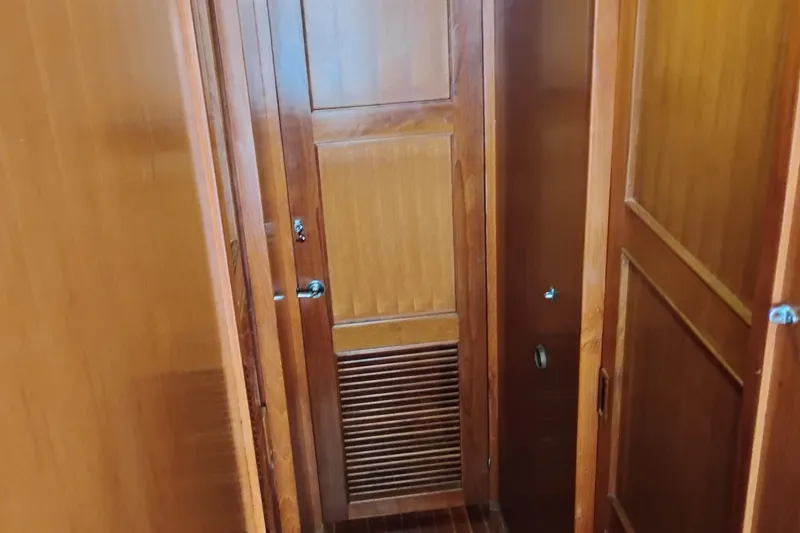 Slide: The Image of Wooden interior of 1978 Puget 38 Europa Trawler, featuring doors and paneling. - 53