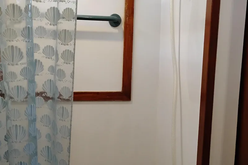 Slide: The Image of Shower area with seashell curtain on 1978 Puget 38 Europa Trawler. - 56