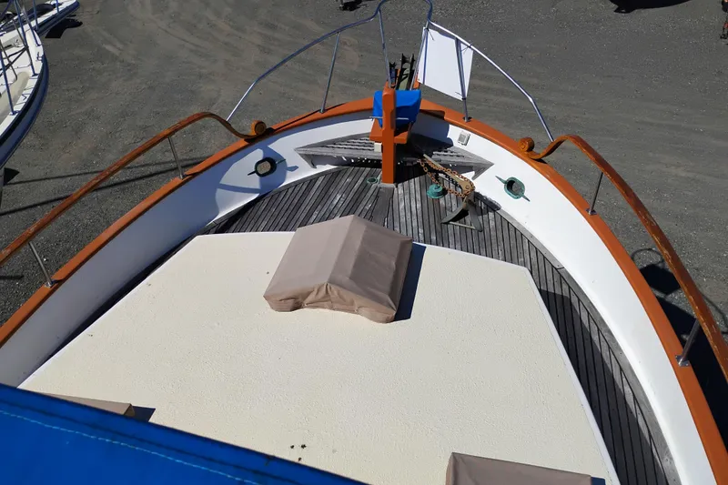 Slide: The Image of 1978 Puget 38 Europa Trawler bow view with anchor and deck details. - 6