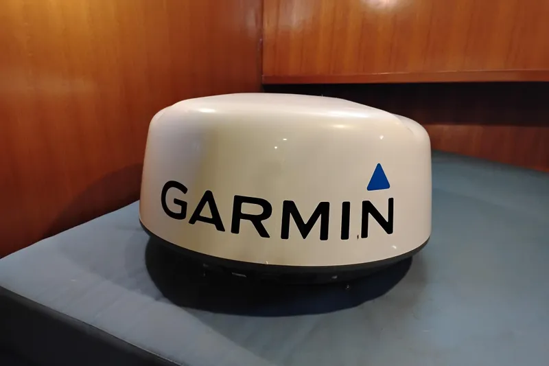 Slide: The Image of Garmin radar dome inside 1978 Puget 38 Europa Trawler, wooden interior background. - 60