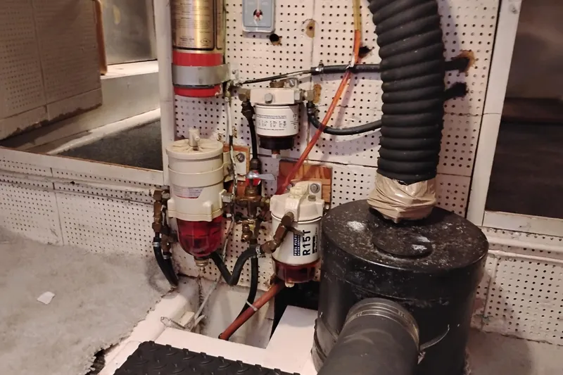 Slide: The Image of Engine room of 1978 Puget 38 Europa Trawler with fuel filters and hoses. - 67