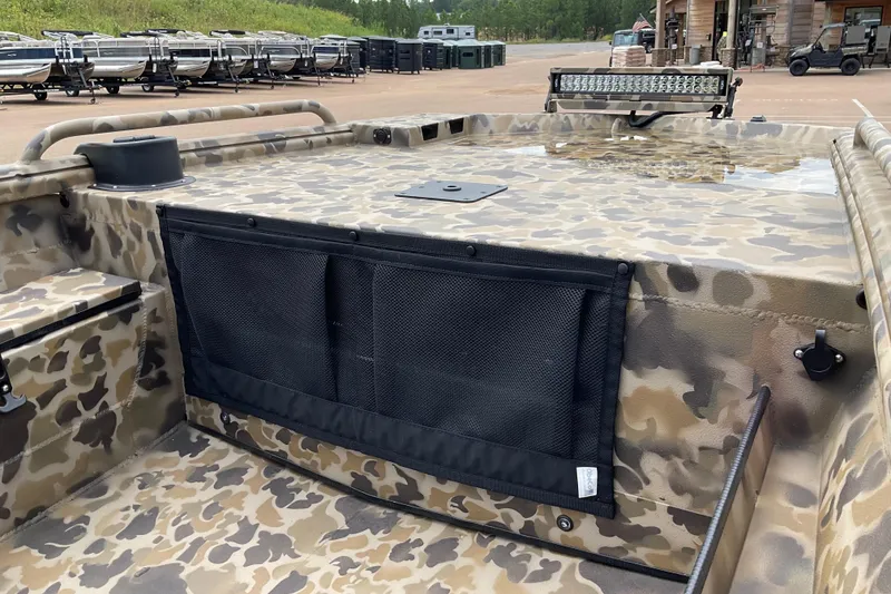 Slide: The Image of 2026 Excel 1751 Viper Duck Boat with camouflage design and storage netting. - 3