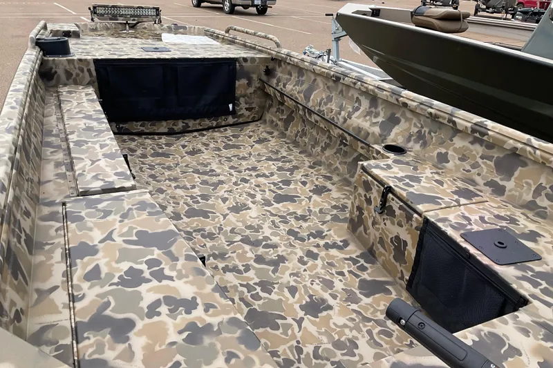 Slide: The Image of 2026 Excel 1751 Viper Duck Boat with camouflage design, parked in a lot. - 7