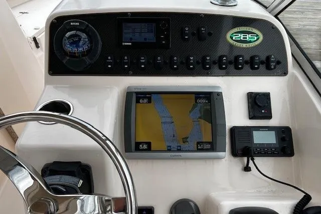 Slide: The Image of Control panel of 2013 Grady-White Freedom 285 boat with navigation equipment. - 6