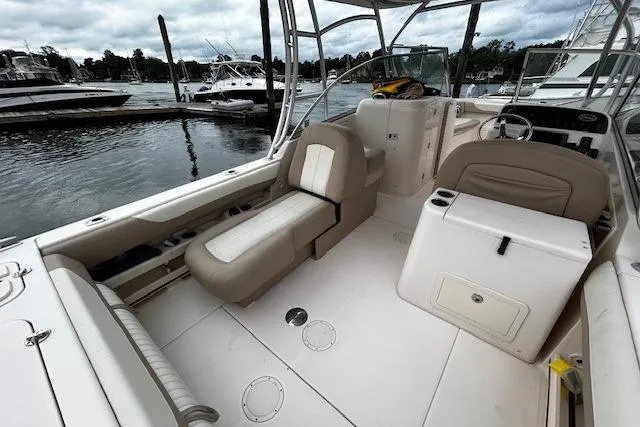 Slide: The Image of 2013 Grady-White Freedom 285 boat interior with seating, docked at marina. - 9