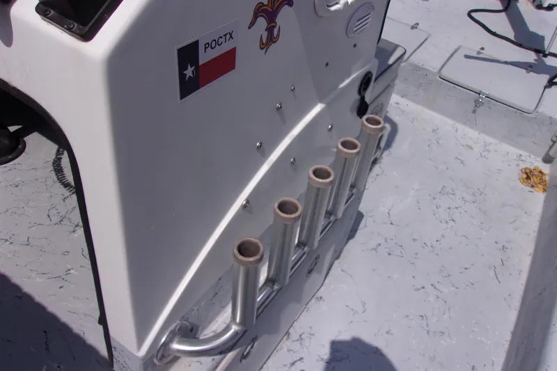 Slide: The Image of Tran Cat 21 boat console with rod holders, Texas flag sticker, 2004 model. - 11