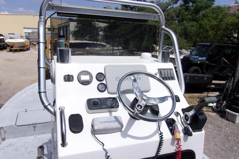 Slide: The Image of 2004 Tran Cat 21 boat console with steering wheel and navigation equipment. - 4