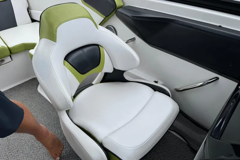 Slide: The Image of White and green seat in 2015 Scarab 195 boat interior. - 12