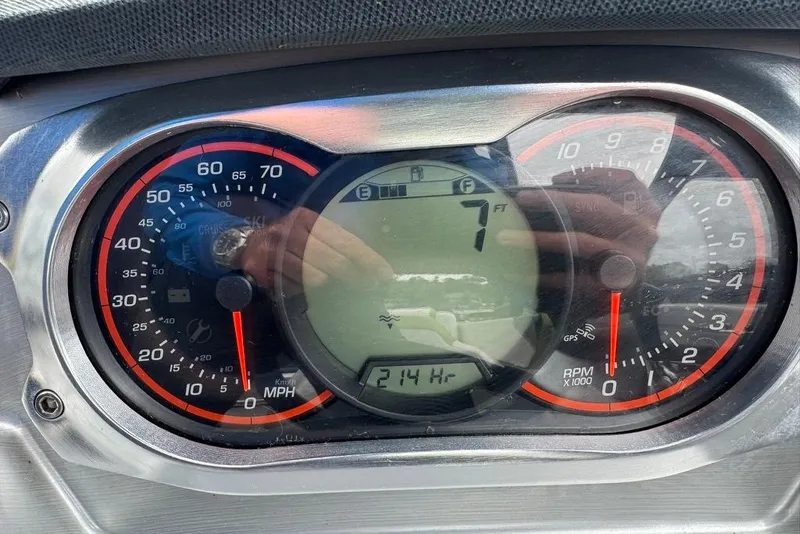 Slide: The Image of Dashboard of a 2015 Scarab 195 showing speedometer and RPM gauges. - 16