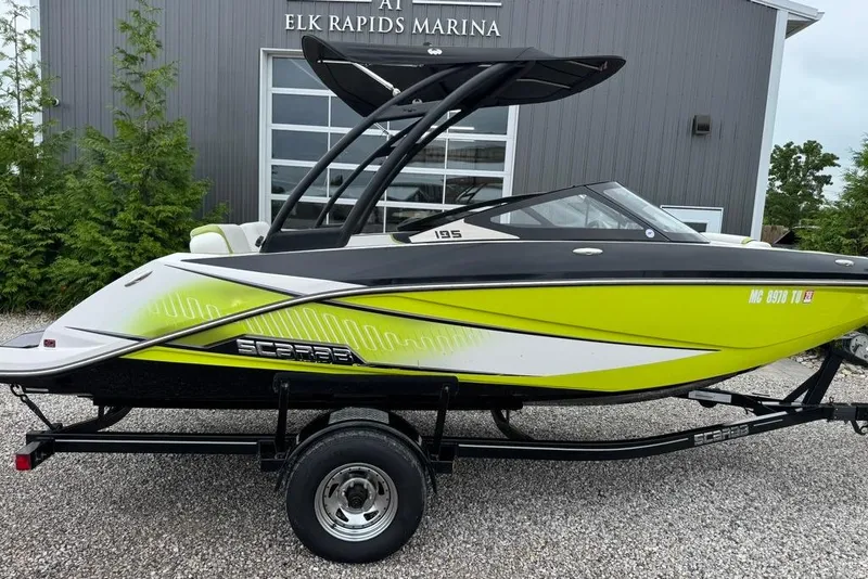 Slide: The Image of 2015 Scarab 195 boat in vibrant green at Elk Rapids Marina. - 2