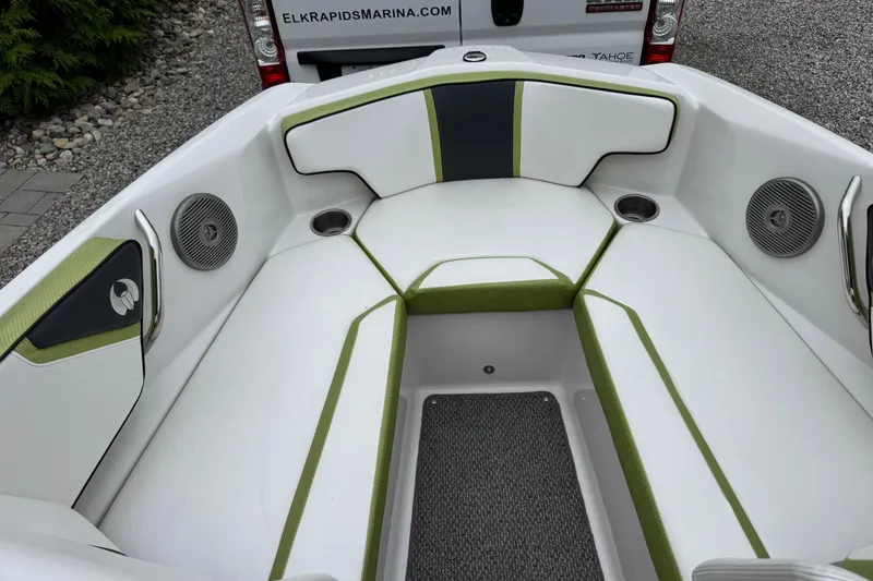 Slide: The Image of Interior of a 2015 Scarab 195 boat with white and green seating. - 8
