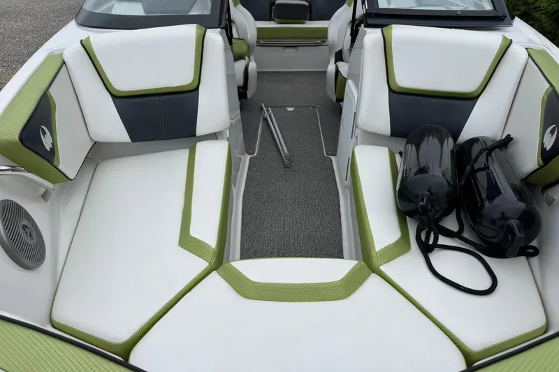 Slide: The Image of 2015 Scarab 195 boat interior with green accents and black fenders. - 9