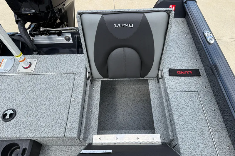 Slide: The Image of 2026 Lund 1775 Impact XS Sport boat interior with gray seating and storage. - 29
