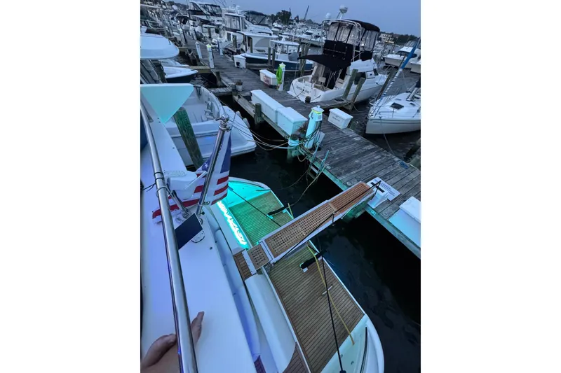 Slide: The Image of 2008 Azimut 55 Fly yacht docked at marina with illuminated gangway. - 12