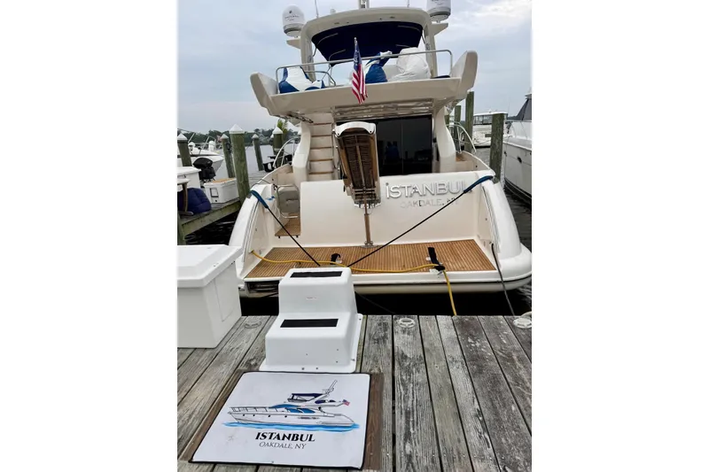Slide: The Image of 2008 Azimut 55 Fly yacht docked, rear view with "Istanbul" nameplate, Oakdale, NY. - 14