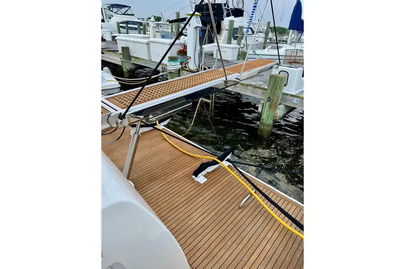 Slide: The Image of Azimut 55 Fly 2008 yacht docked with wooden deck and marina view. - 16
