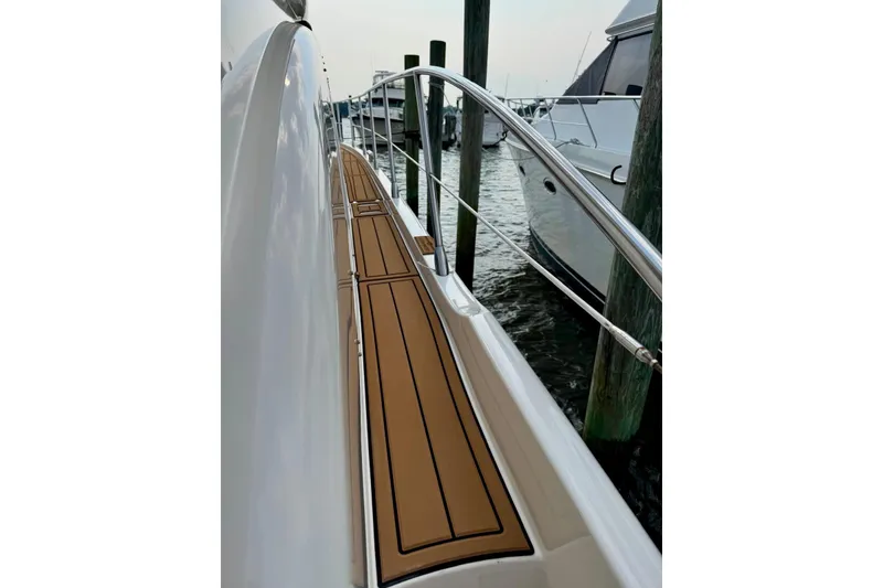 Slide: The Image of 2008 Azimut 55 Fly yacht side deck with wooden flooring, docked at marina. - 22