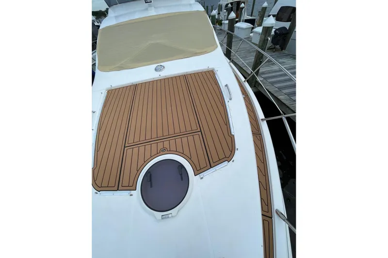 Slide: The Image of 2008 Azimut 55 Fly yacht deck with wood finish, docked at marina. - 23