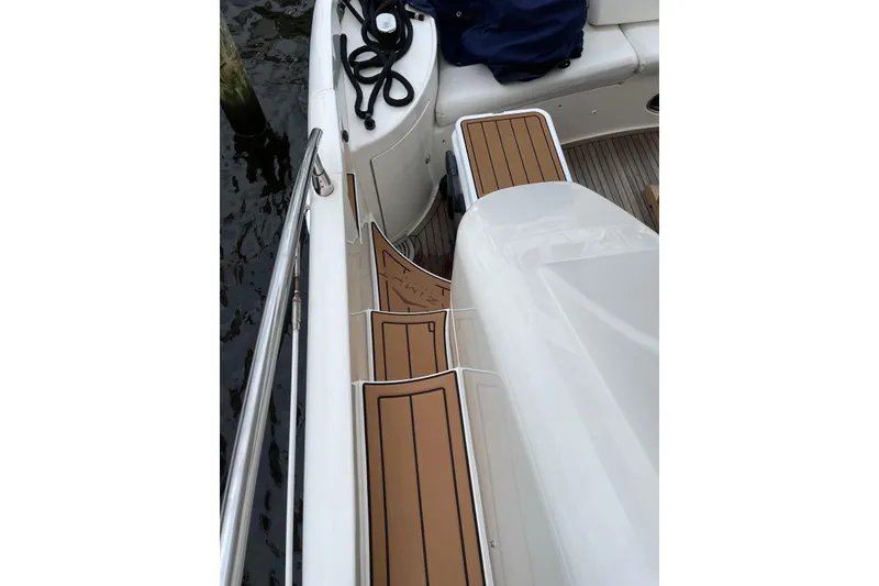 Slide: The Image of 2008 Azimut 55 Fly yacht deck with teak flooring and railing. - 26