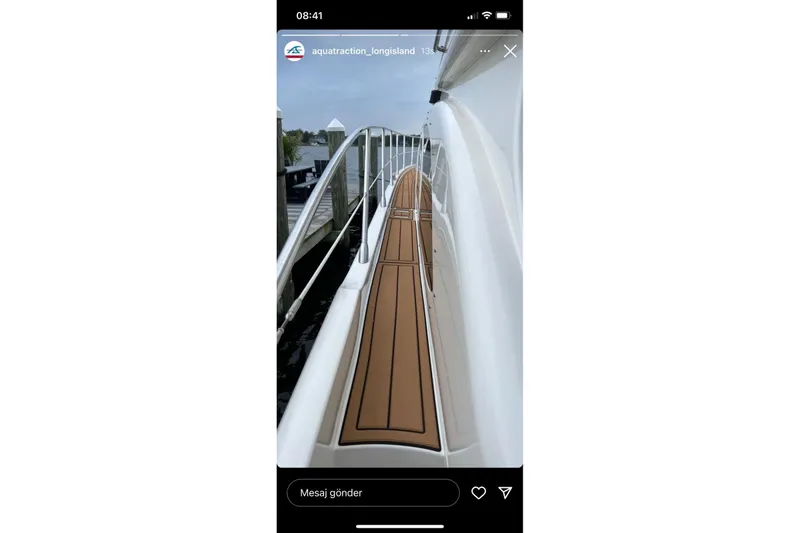 Slide: The Image of 2008 Azimut 55 Fly yacht docked, featuring sleek deck design and modern aesthetics. - 29