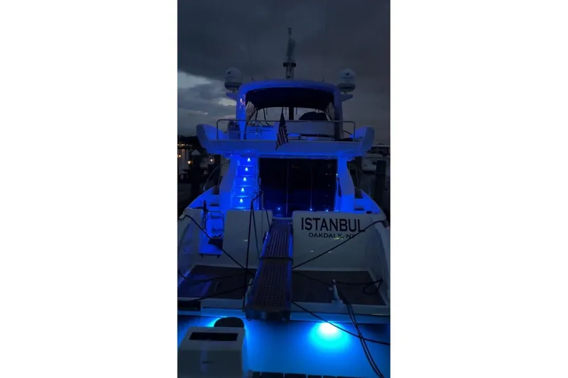 Slide: The Image of 2008 Azimut 55 Fly yacht with blue lights at night, docked in Istanbul. - 30