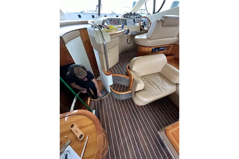 Slide: The Image of Luxurious interior of 2008 Azimut 55 Fly yacht with leather seating and wood accents. - 36