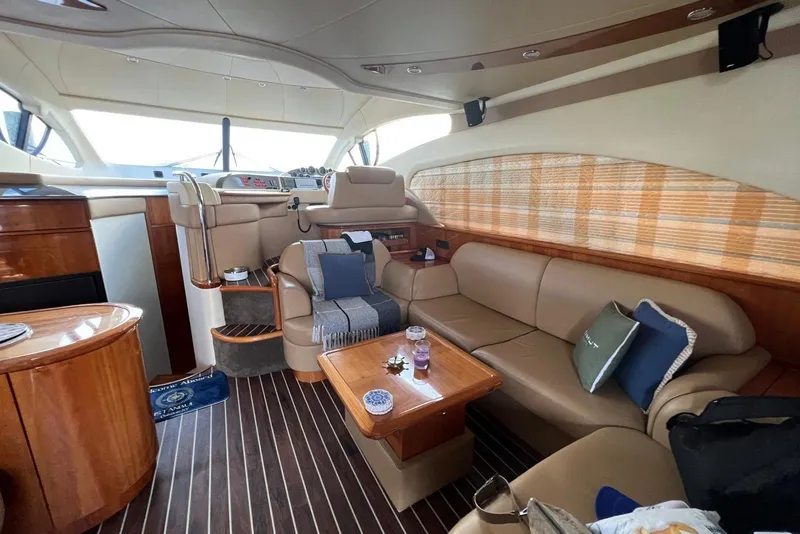 Slide: The Image of Luxurious interior of a 2008 Azimut 55 Fly yacht with elegant seating and wood finishes. - 38