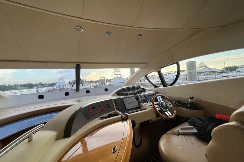 Slide: The Image of Interior view of 2008 Azimut 55 Fly yacht cockpit with steering wheel and navigation controls. - 41