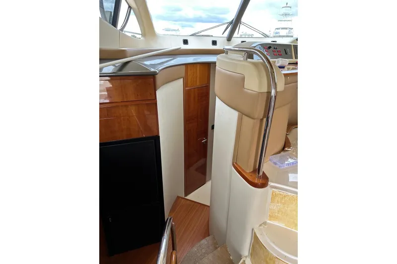 Slide: The Image of Interior view of 2008 Azimut 55 Fly yacht, featuring elegant wood finishes and modern design. - 46