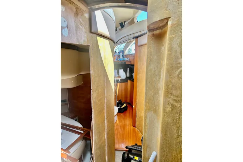 Slide: The Image of Interior view of 2008 Azimut 55 Fly yacht, showcasing cabin and wooden flooring. - 49