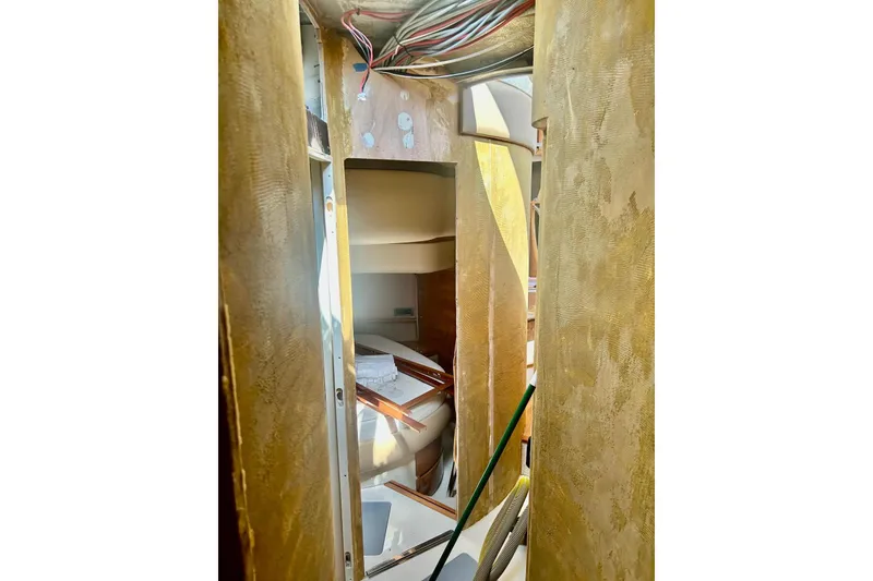 Slide: The Image of Interior view of 2008 Azimut 55 Fly yacht under renovation, showing exposed wiring and unfinished surfaces. - 50