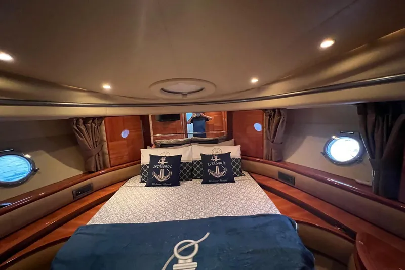 Slide: The Image of Luxurious cabin interior of 2008 Azimut 55 Fly yacht with elegant bedding and portholes. - 52