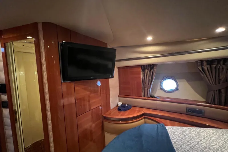 Slide: The Image of Luxurious cabin interior of 2008 Azimut 55 Fly yacht with TV and porthole window. - 53