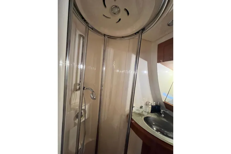 Slide: The Image of Luxurious bathroom in 2008 Azimut 55 Fly yacht with modern shower and sink. - 58