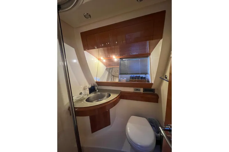 Slide: The Image of Luxurious bathroom in 2008 Azimut 55 Fly yacht with modern fixtures and wood accents. - 63