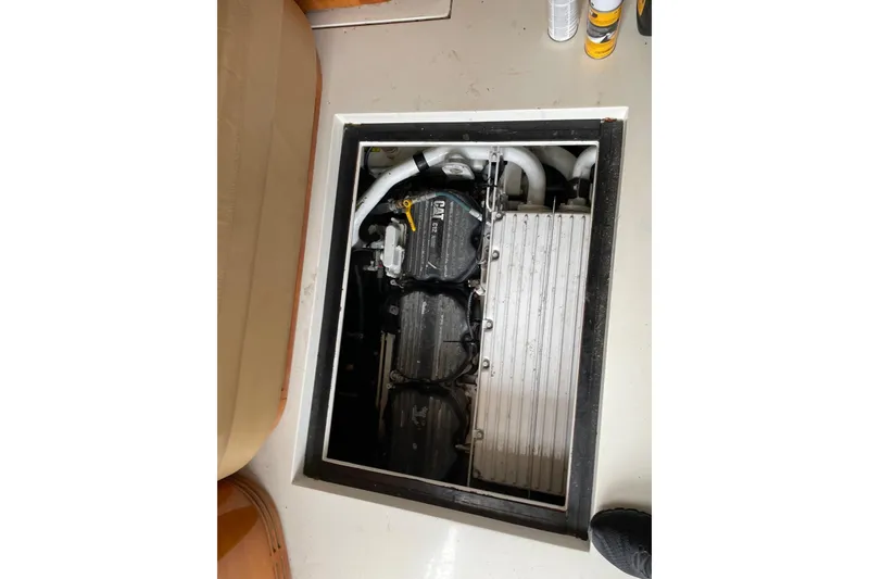 Slide: The Image of Engine compartment of a 2008 Azimut 55 Fly yacht, showcasing mechanical components. - 70