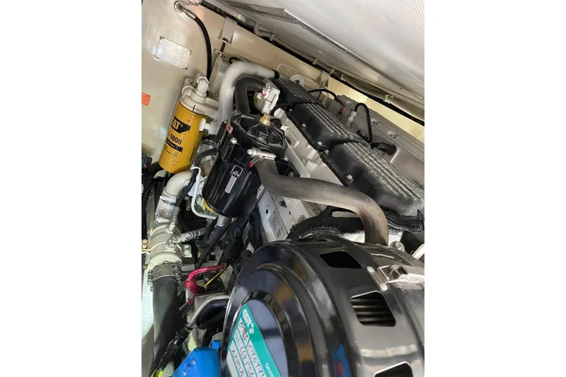 Slide: The Image of Engine compartment of a 2008 Azimut 55 Fly yacht, showcasing mechanical components. - 75