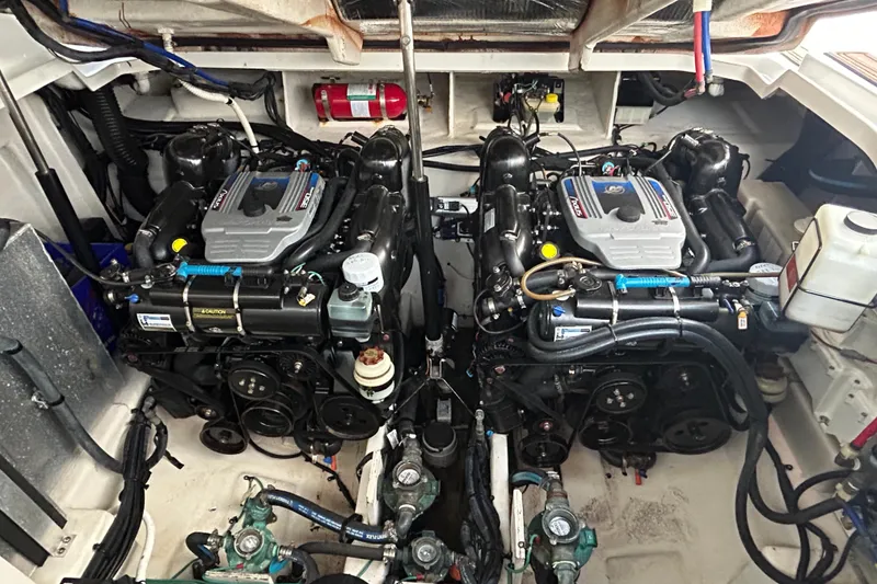 Slide: The Image of Engine room of a 2010 Sea Ray Sundancer 330 with dual engines and equipment. - 15
