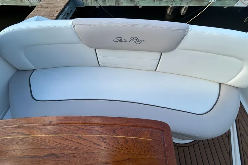 Slide: The Image of Luxurious seating on 2010 Sea Ray Sundancer 330 yacht with wooden table. - 7