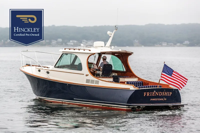 The Image of Hinckley Picnic Boat MKIII 2010 on water, American flag, certified pre-owned. - 0
