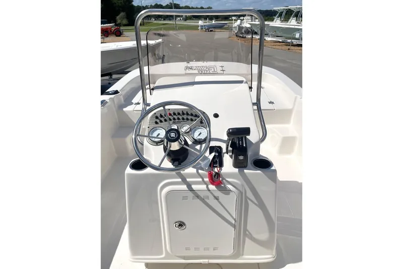 Slide: The Image of 2026 Carolina Skiff 19 LS boat console with steering wheel and controls. - 24