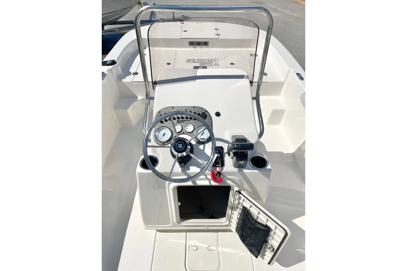 Slide: The Image of 2026 Carolina Skiff 19 LS boat console with steering wheel and gauges. - 25
