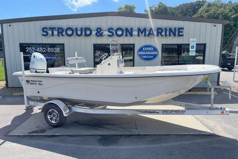 Slide: The Image of 2026 Carolina Skiff 19 LS boat on trailer at Stroud & Son Marine dealership. - 5